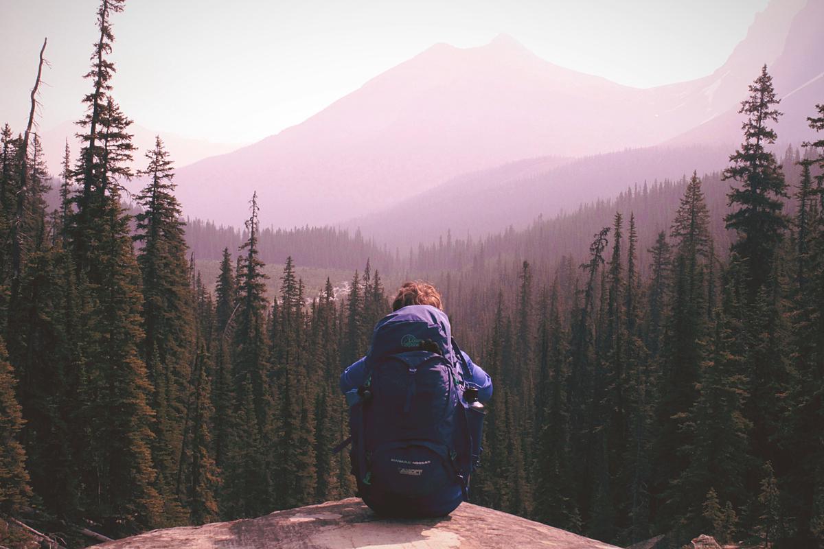 Image of a person with a backpack exploring a beautiful mountain landscape