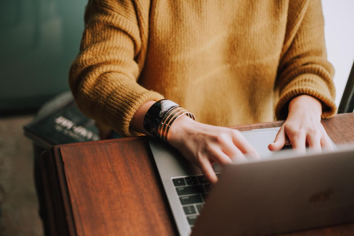 Image of a person using a laptop to plan a trip